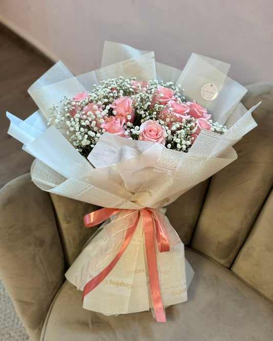 Pink roses with gypsophila